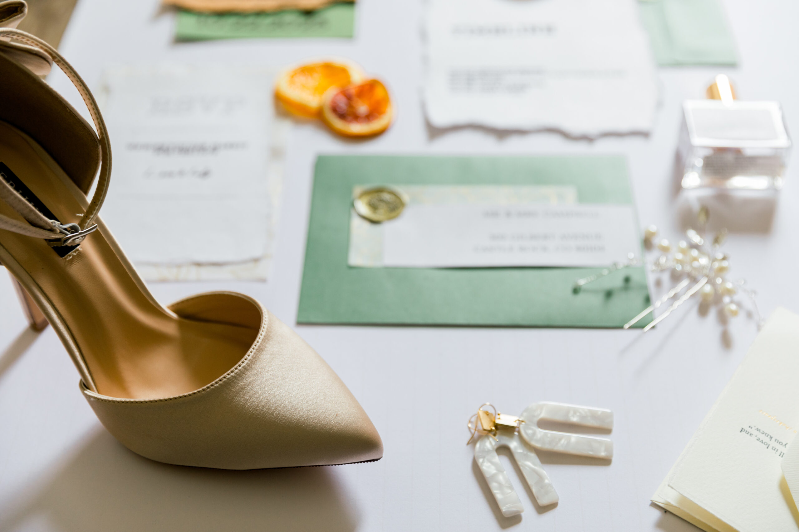 wedding-shoe-and-wedding-invitations-on-white-back-2026-01-07-02-04-57-utc
